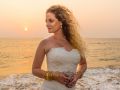 Resh Rall Photographs Abigail in bridal dress by the beach in India